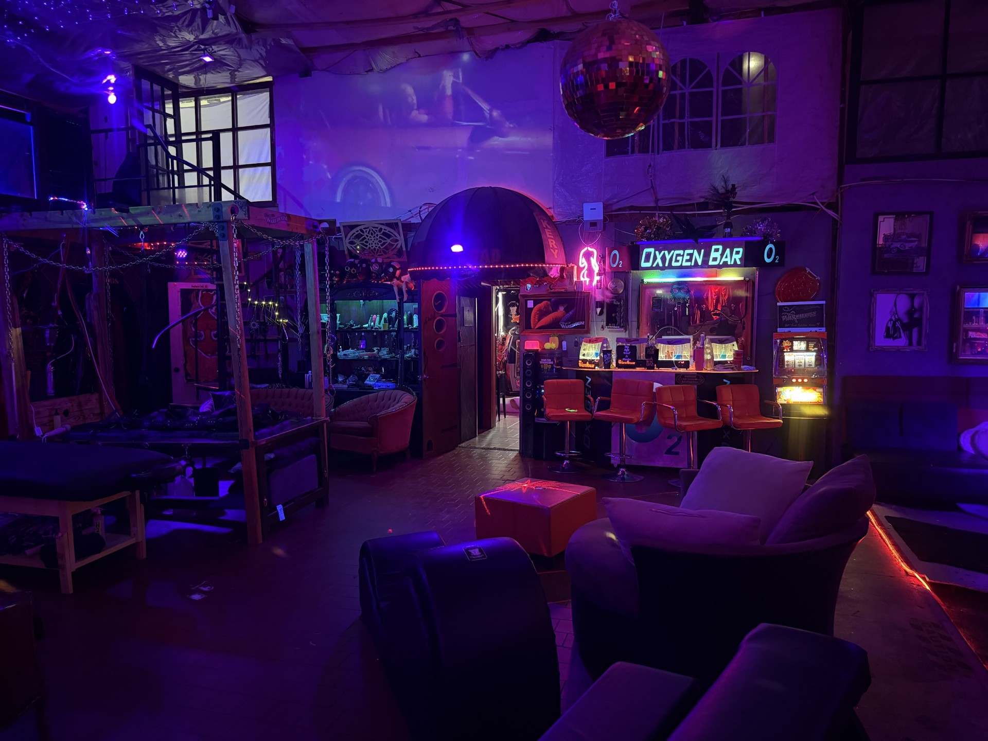 The Warehouse main room under purple and red lighting